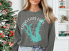Gray sweatshirt with Calaveras Lake Texas map and compass graphic and text.