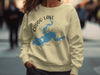 Cream sweatshirt with Caddo Lake map and compass graphic and "TEXAS" text.