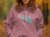 Rose pink hoodie with Canyon Lake Texas graphic and compass design.