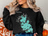 Black sweatshirt with Webster Lake Massachusetts map and compass design.