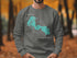 Gray sweatshirt with "Beautiful Forest Lake Minnesota" text and compass graphic.
