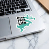 Turquoise sticker with black text "Pine Flat Life" on a laptop.