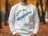 White crewneck sweatshirt with Sardis Lake Mississippi map and compass design.