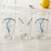 Three clear glasses with blue Lake Memphremagog map and compass design.