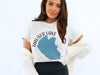 White t-shirt with "Hauser Lake Idaho" graphic and blue lake outline.