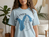 Light blue t-shirt with Lake Union Washington map graphic and compass graphic.