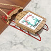 Miniature wooden sled ornament with "Merry Christmas from Medina Lake" text.