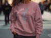 Rose crewneck sweatshirt with Lay Lake Alabama compass graphic.