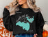 Black sweatshirt with "Brooks and Hess Lake Michigan" and a compass rose.