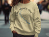 Light yellow crewneck sweatshirt with compass design and text "Lake Francis Case South Dakota".