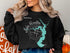Black sweatshirt with Lake Houston map and compass graphic.