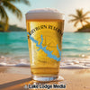 Beer glass with Rayburn Reservoir map design on a beach with palm trees.