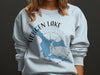 Light blue sweatshirt with Hebgen Lake Montana map and compass design.