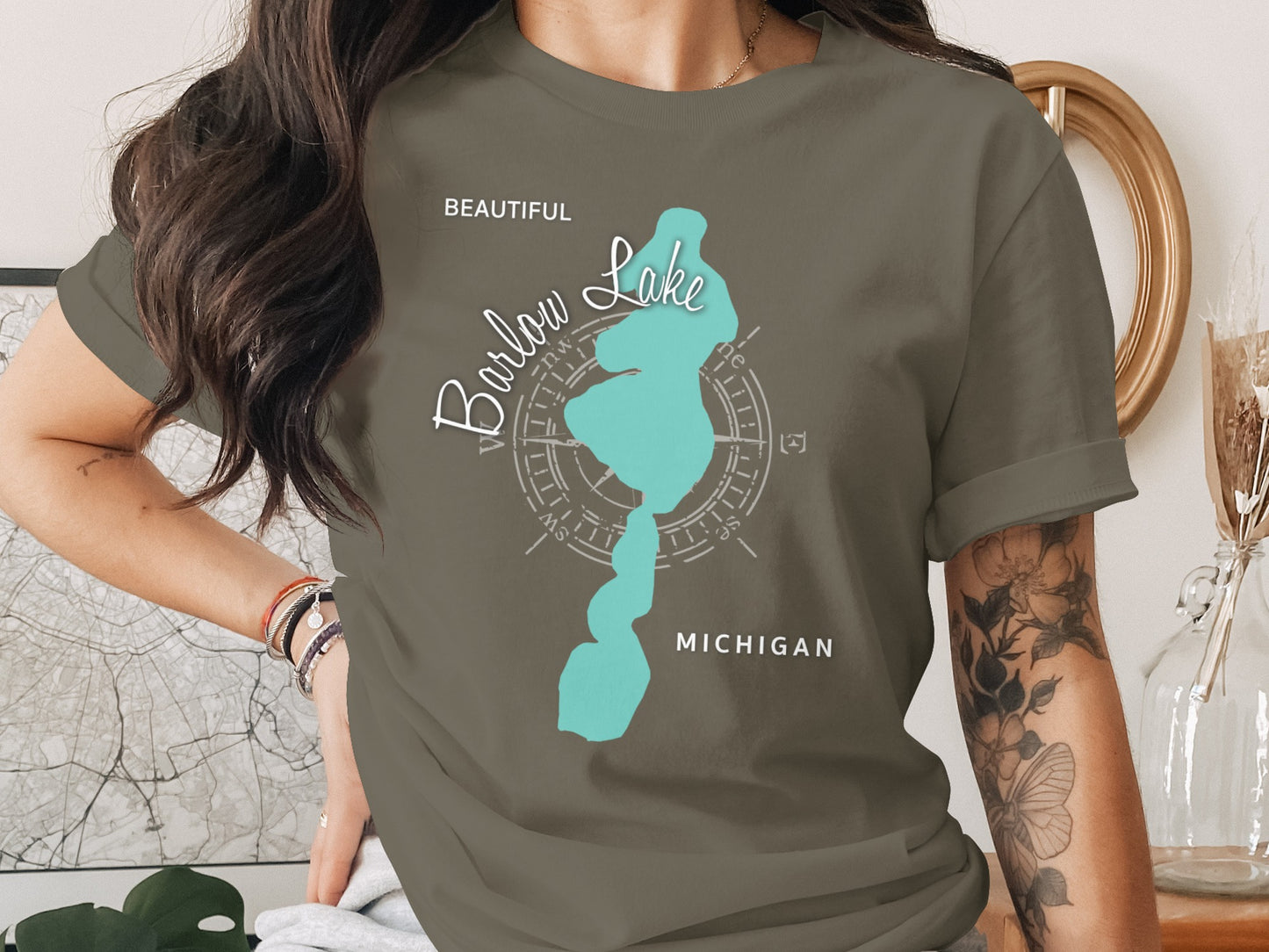 Olive green t-shirt with "Beautiful Barlow Lake Michigan" text and compass rose.