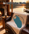 Woven blanket featuring a teal Round Valley Reservoir map and compass on a couch.