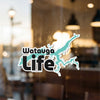 Watauga Life sticker with lake outline on a glass surface.