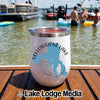 White insulated tumbler featuring a blue Yellowstone Lake graphic sitting on a wooden boat deck.
