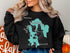 Black sweatshirt with a teal map outline of Lake Massabesic, New Hampshire.