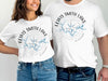 White t-shirts featuring "Lewis Smith Lake Alabama" with a compass and lake graphic.