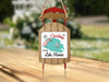 Sled ornament with "Merry Christmas from Lake Monroe" text and snowflake graphics.