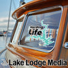 Harding Life turquoise sticker on boat window, "Lake Lodge Media" text below.
