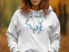 White hoodie with "Lake Texoma Oklahoma" text and compass graphic featuring lake map.