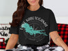 Black t-shirt with Lake Kabetogama, Minnesota graphic and compass design.