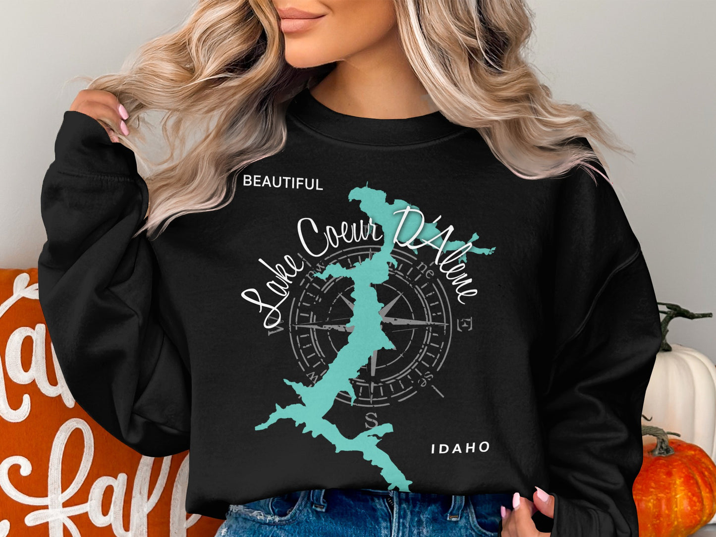 Black sweatshirt with "Lake Coeur d'Alene Idaho" and compass graphic.