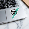 Green Bay Life sticker in black text on turquoise map outline on laptop.