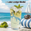 Glass with beverage and "Atook Lake Oklahoma" map design on beach background.