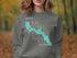 Crewneck sweatshirt with teal Bass Lake California map and compass rose design.