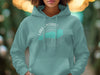 Teal hoodie with Lake Ontario map and compass graphic.