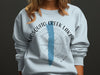 Light blue sweatshirt with "Mosquito Creek Lake Ohio" text and compass graphic.