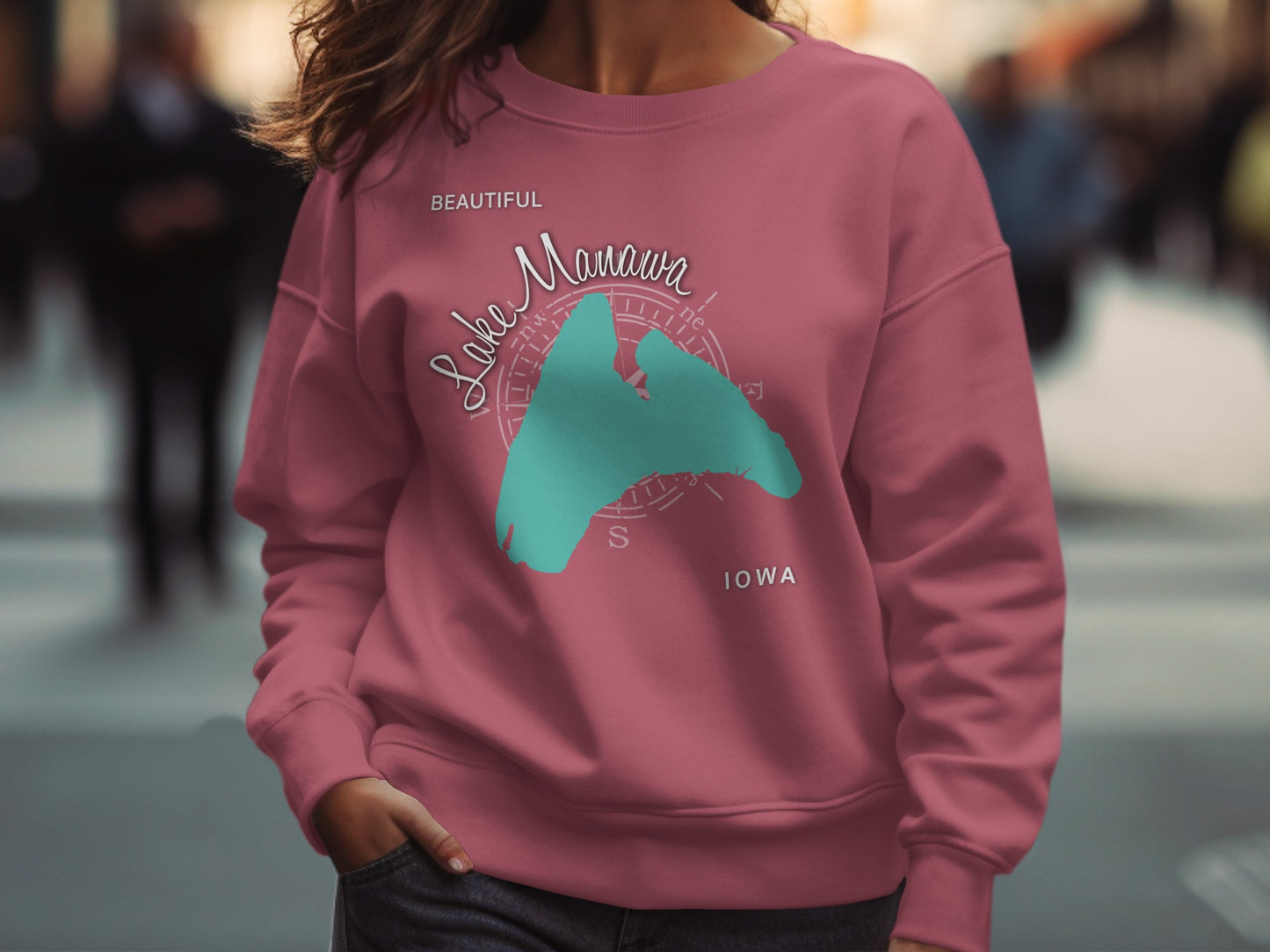 Pink sweatshirt with a teal graphic of Lake Manawa, Iowa.