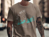 Brown t-shirt on a man featuring a compass graphic with Key West, Florida graphic.