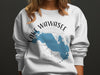 White sweatshirt with blue Lake Wawasee, Indiana map and compass design.