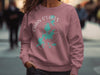 Pink crewneck sweatshirt with Chain O'Lakes Illinois map and compass design.