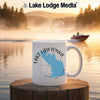 White mug with "Lake Lawtonka Oklahoma" design on a lake background.