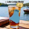 Glass of iced tea with "Emerald Lake Canada" graphic on a lake background.