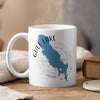 White mug with blue Gull Lake, Michigan outline and compass graphic.