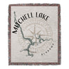 Mitchell Lake Alabama map design on a fringed woven blanket with compass graphic.