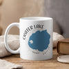 White mug with "Crater Lake Oregon" and map graphic, steaming.