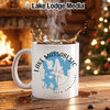 White mug with "Lake Massabesic New Hampshire" design and coffee splash.