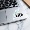 Chickamauga Life sticker with lake outline on a laptop.