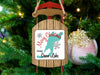 Sled ornament with "Merry Christmas from Snow Lake" text and snowflake graphics.