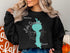Black sweatshirt with "Beautiful Lake Dunmore Vermont" map and compass design.