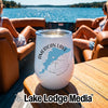 White stemless wine tumbler with a blue map graphic and American Lake Washington text sits on a boat table.