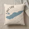 Pillow with blue Lake Erie outline over compass graphic and text.