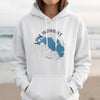 White hoodie with blue Lake Wawasee Indiana graphic and compass rose.