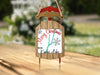 Sled ornament with "Merry Christmas" and "From Keuka Lake" text.